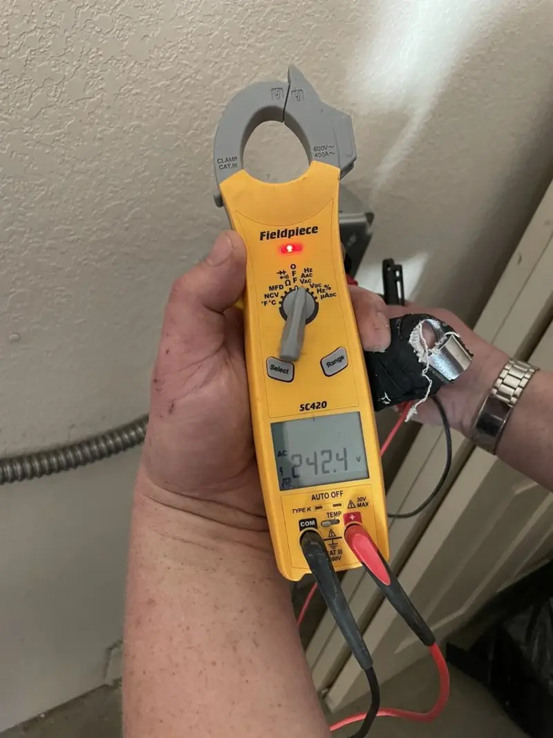 Voltage testing with clamp meter during Whole House Surge Protector in Dranesville